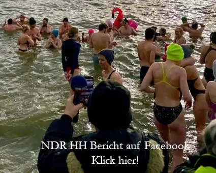 Journalist nimmt Bilder von Eisbader in der Elbe auf.